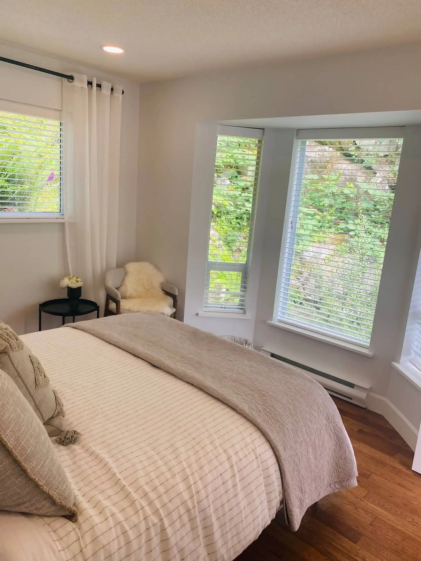 Bedroom 4 with queen bed and bay window