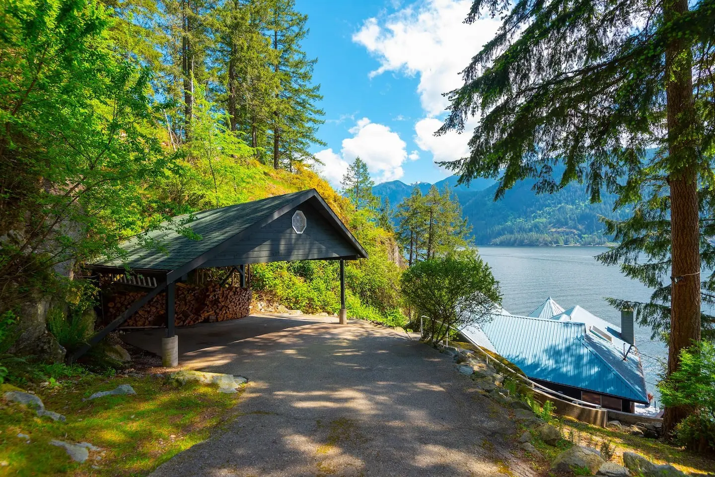 Carport and woodshed at the end of the forest driveway