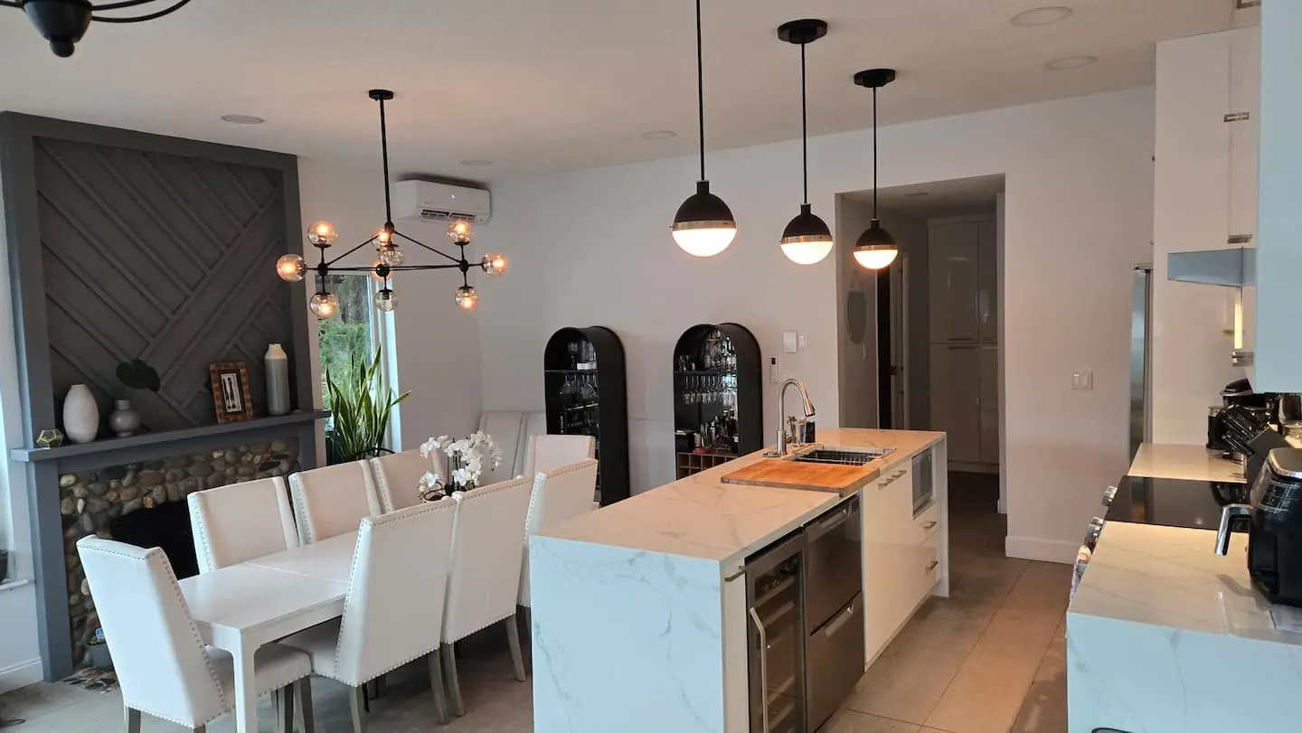 Kitchen and dining room with island and pendant lights