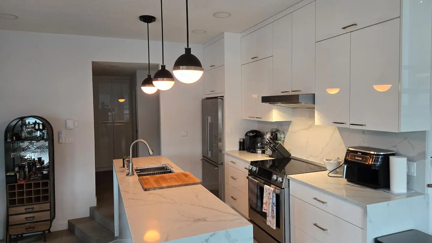 Kitchen with stainless appliances and marble island