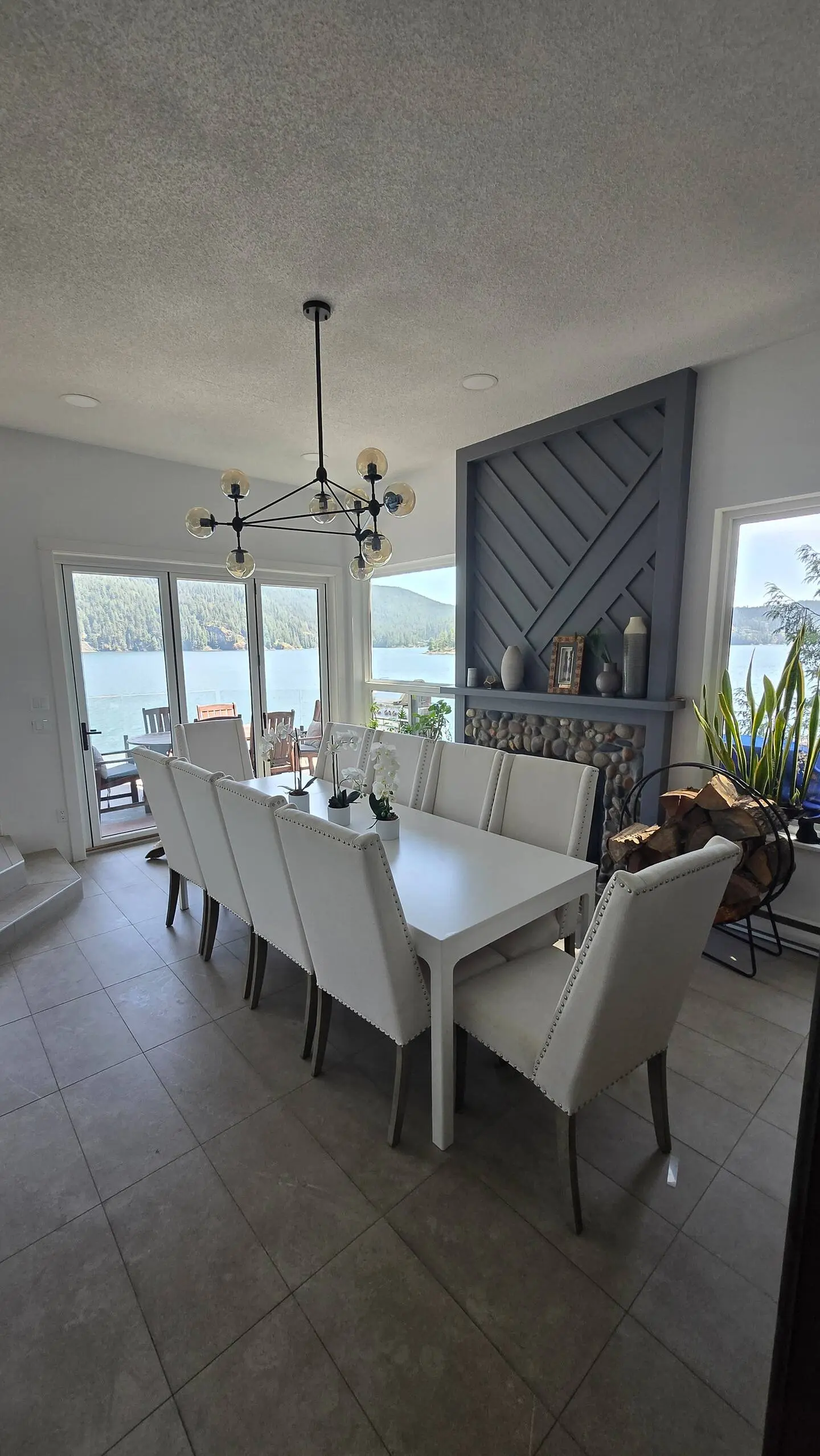 Long dining table with views of the water